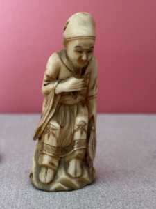 2 Photo small man carving.