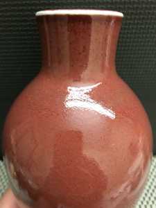 vintage red Asian vase glaze detail